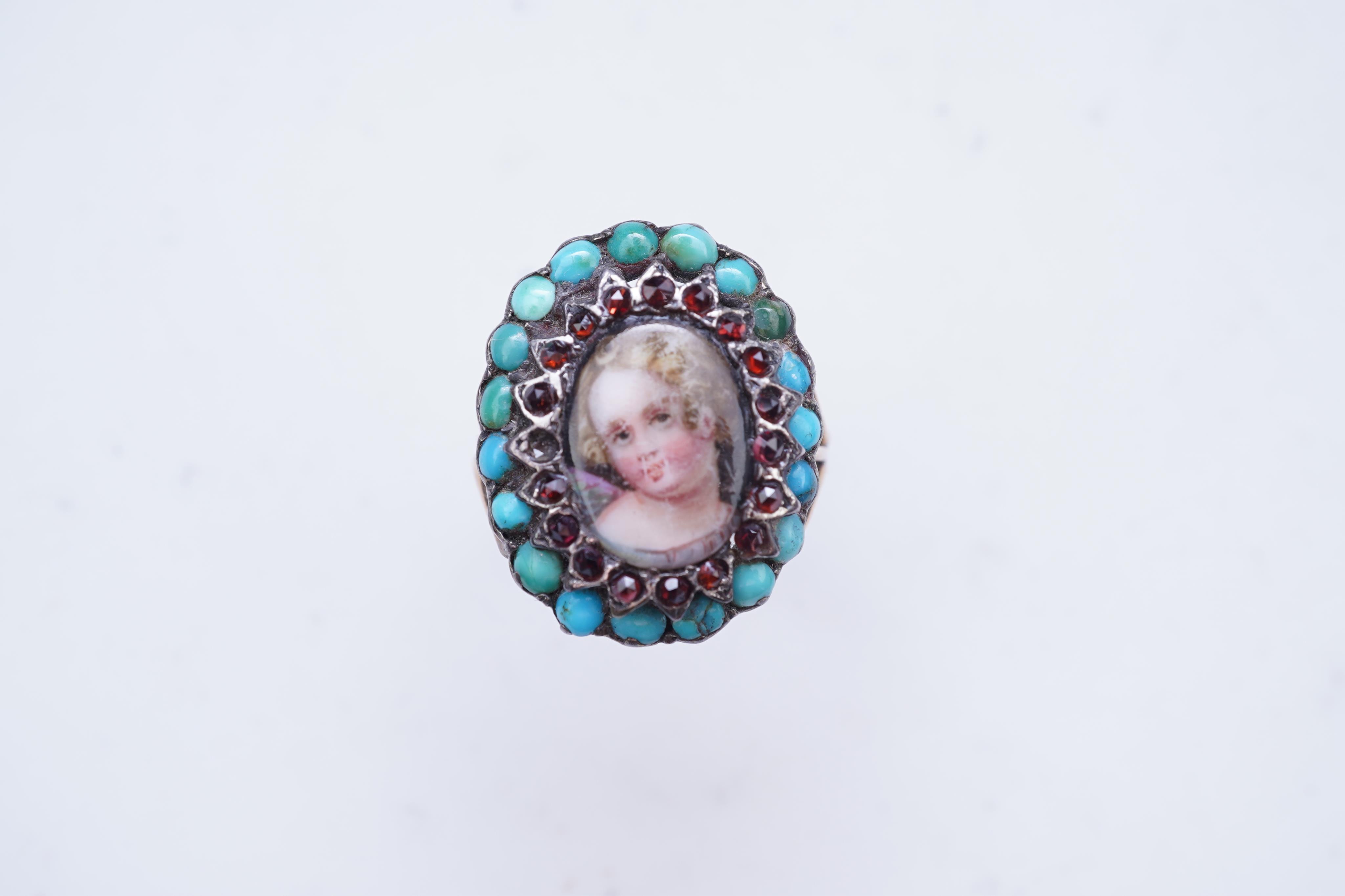 An enamel miniature, turquoise and garnet ring